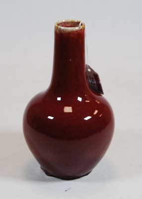 Lot 252 - A Chinese sang-de-boeuf vase, of onion shape,...