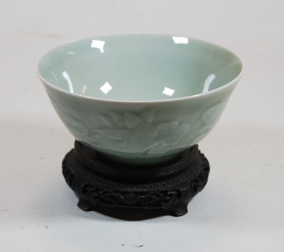 Lot 254 - A Chinese celadon glazed bowl, the exterior...