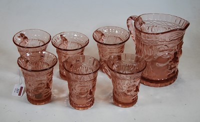 Lot 257 - An early 20th century pink tinted moulded...