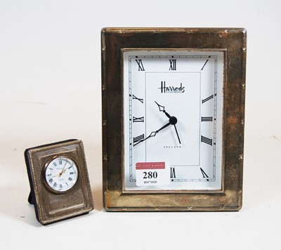 Lot 280 - A modern silver clad mantel clock, of...