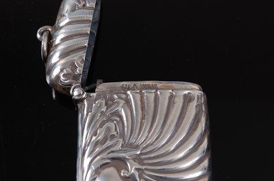 Lot 2104 - A silver vesta, of hinged rectangular form,...