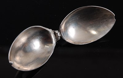 Lot 2106 - A George V silver folding double-ended spoon,...