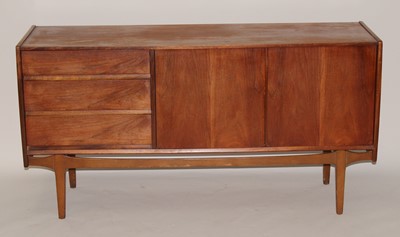 Lot 385 - A 1960s teak sideboard by Nathan, having twin...