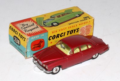 Lot 1689 - A Corgi Toys No. 238 Jaguar Mk X comprising of...