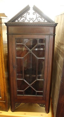 Lot 1226 - An early 20th century mahogany corner cabinet,...