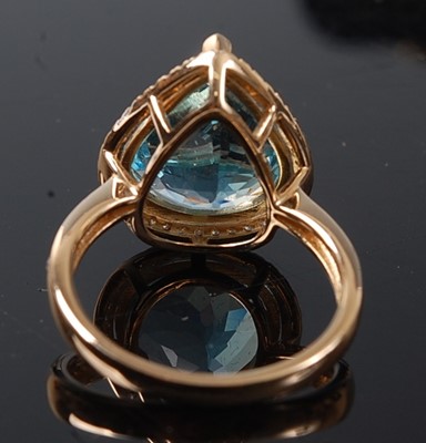 Lot 2202 - A yellow metal, topaz and diamond pear shaped...