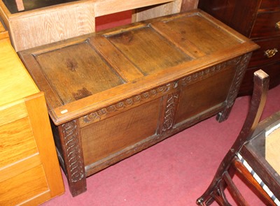 Lot 1256 - A 19th century oak coffer, having a hinged...