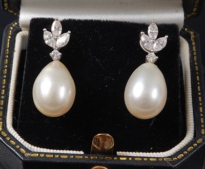 Lot 2209 - A pair of white metal, pearl and diamond drop...