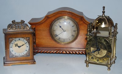 Lot 49 - A 1920s walnut cased mantel clock having an...