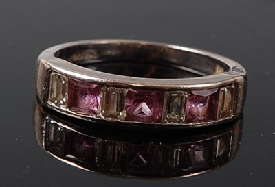 Lot 2212 - An 18ct white gold, pink sapphire and diamond...
