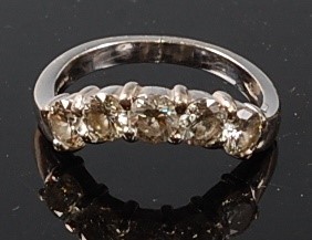 Lot 2213 - An 18ct white gold diamond five-stone shaped...