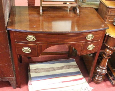 Lot 1230 - A circa 1900 mahogany bowfront washstand, w.86....