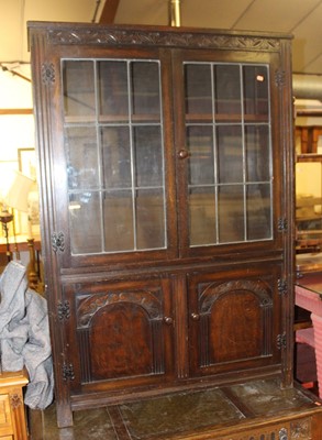 Lot 1276 - A moulded oak bookcase, w.106cm