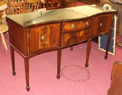 Lot 1246 - A reproduction mahogany serpentine sideboard,...