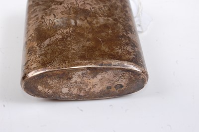 Lot 265 - An Edwardian silver pocket hip flask of oval...