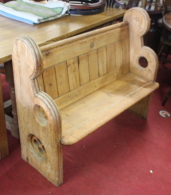 Lot 1334 - A panelled pine church pew, w.118cm