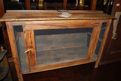 Lot 1257 - A stained pine and mesh inset hutch, width...