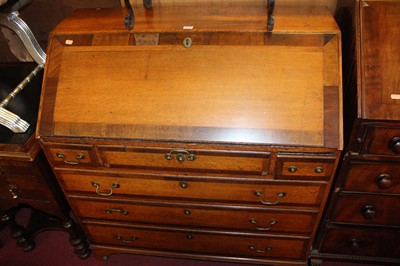 Lot 1413 - A Geoge III oak bureau on bracket feet, 98cm