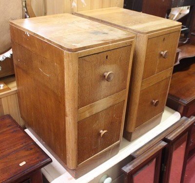 Lot 1434 - A pair of 1930's light oak bedside chests, w.32cm