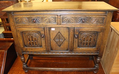 Lot 1409 - A small joined and relief carved oak dresser...