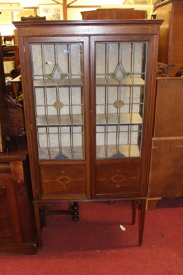 Lot 1424 - An Edwardian inlaid mahogany display cabinet,...