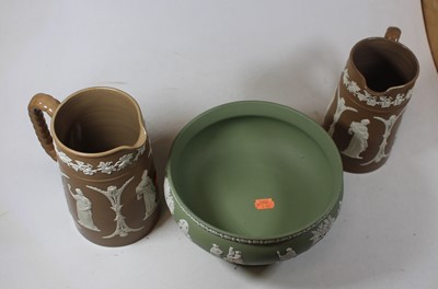 Lot 15 - Two Wedgwood brown jasperware jugs, together...
