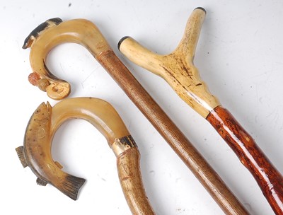 Lot 257 - A thumbstick walking stick, the rams horn...