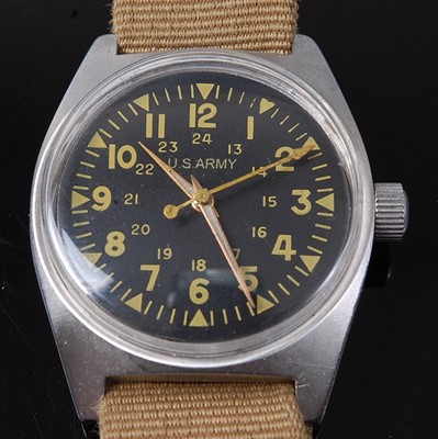 Lot 75 - A Vietnam War U.S. Army steel cased wristwatch,...