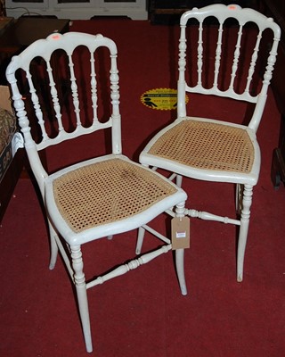 Lot 1313 - A pair of Victorian cane seated ivory painted...