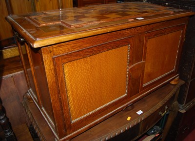 Lot 1441 - An oak twin panelled hinged top blanket box,...
