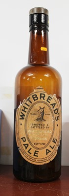 Lot 24 - A Whitbread's oversized brown glass Pale Ale...