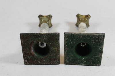 Lot 10 - A pair of brass and veined marble candlesticks,...