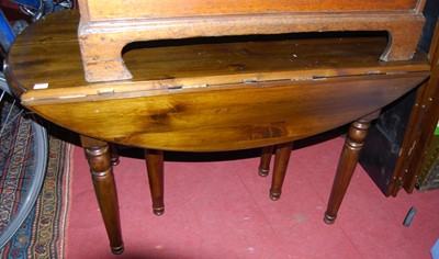 Lot 1321 - A modern stained pine dropflap extending...