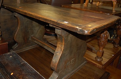 Lot 1344 - A provincial elm dining table, the twin plank...