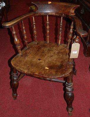 Lot 1317 - An elm seated smoker's bow armchair