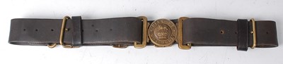 Lot 124 - A British Army black leather belt, the brass...