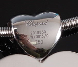 Lot 2229 - An 18ct white gold Chopard 'Love' pendant,...