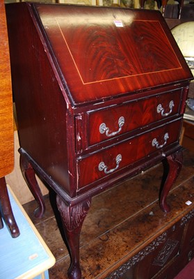 Lot 1241 - A reproduction mahogany two drawer writing...