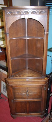 Lot 1207 - A contemporary moulded oak freestanding corner...