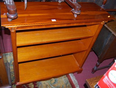Lot 1294 - A reproduction yew wood low freestanding open...