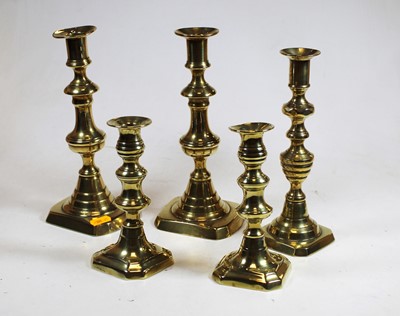 Lot 18 - Two pairs of Victorian brass candlesticks,...