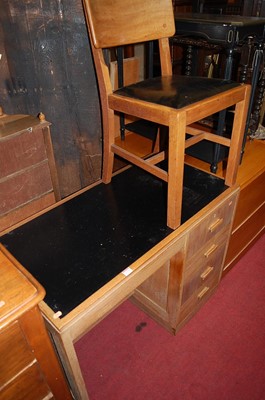 Lot 1250 - An Art Deco limed oak single pedestal writing...