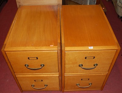 Lot 1253 - A pair of Art Deco light oak and plywood low...