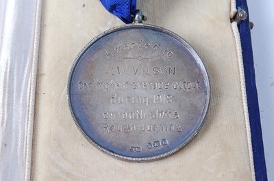Lot 144 - A George V Munitions Factory silver medal the...