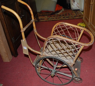 Lot 1285 - An early 20th century bamboo doll's cart