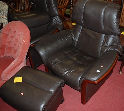 Lot 1382 - A pair of contemporary Stressless chocolate...