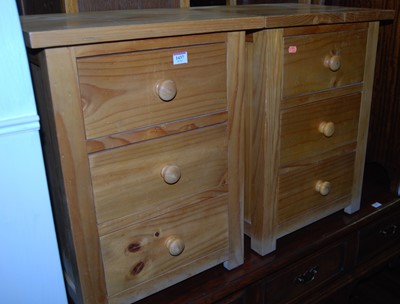 Lot 1437 - A pair of modern pine three drawer bedside...