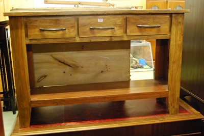 Lot 1450 - An Eastern hardwood three drawer two-tier side...