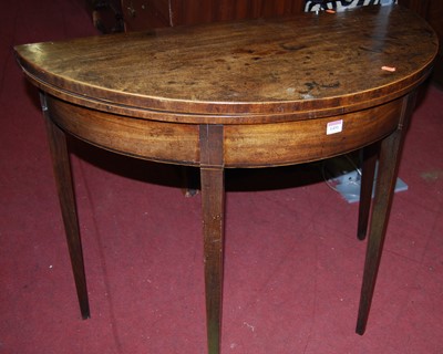 Lot 1451 - An early 19th century mahogany demi-lune...