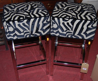 Lot 1454 - A pair of contemporary polished chrome framed...